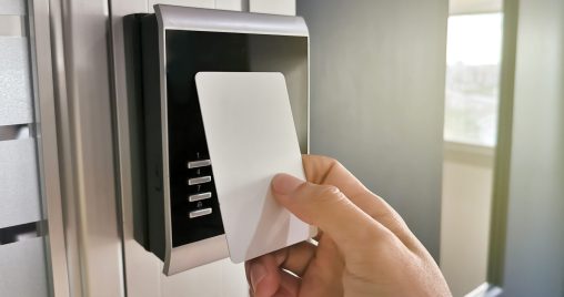 Hand using Key card;access control concept