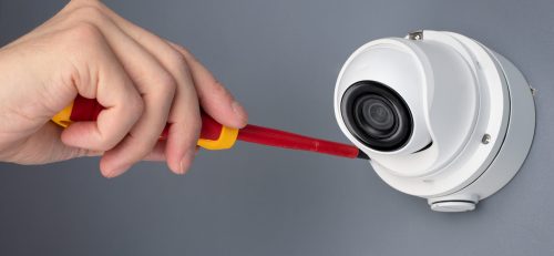 Technician installing CCTV camera video security